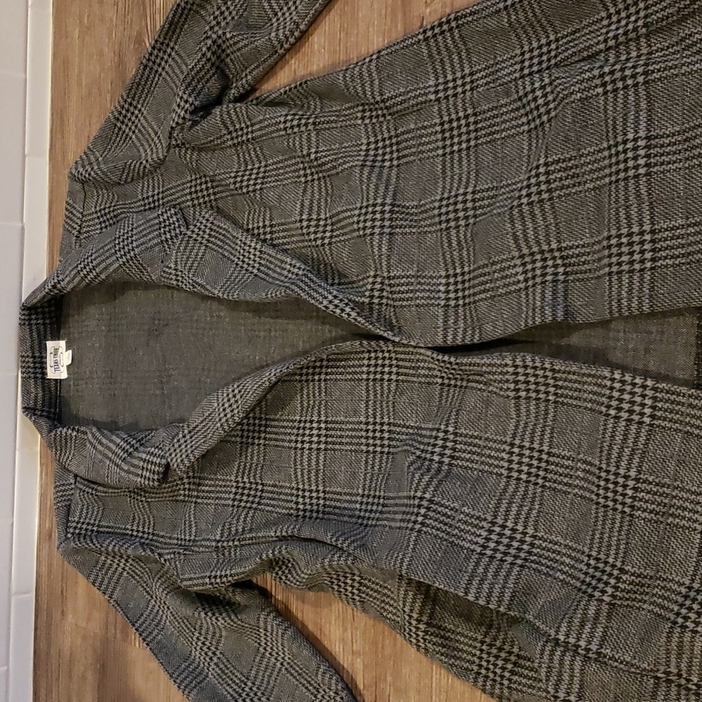 Women's blazer with  pockets and side slits on sides.  Very flattering. New.